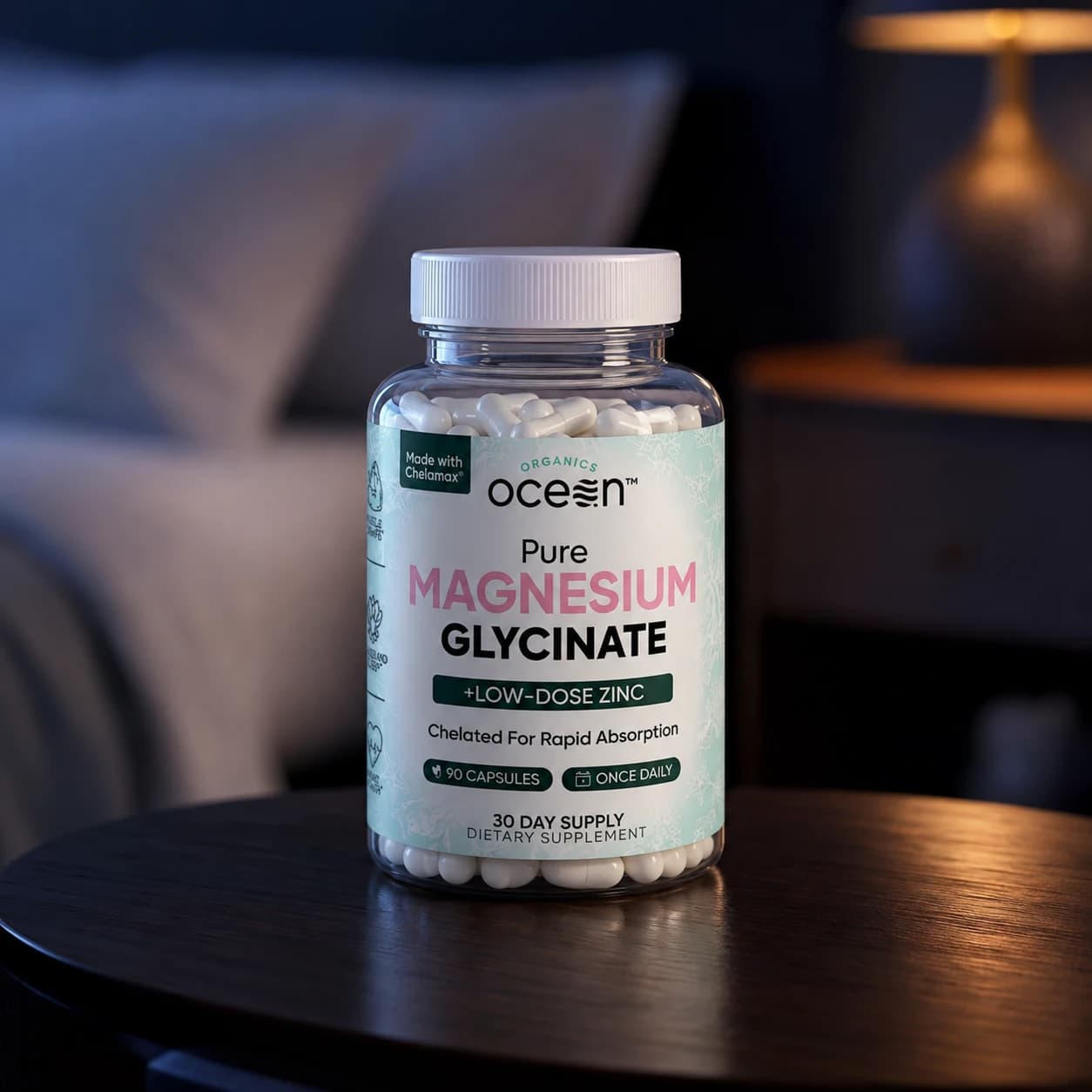 The Organics Ocean Pure Magnesium Glycinate with Zinc bottle on a bedside table at night, front label facing the camera